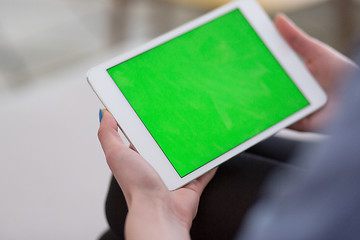 Image showing woman on sofa using tablet computer