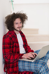 Image showing freelancer in bathrobe working from home