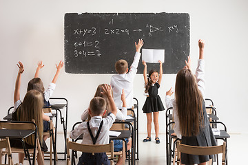 Image showing School children in classroom at lesson