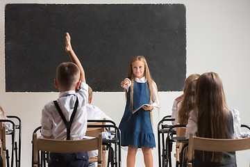 Image showing School children in classroom at lesson