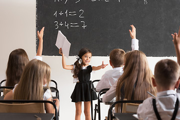 Image showing School children in classroom at lesson