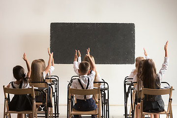 Image showing School children in classroom at lesson