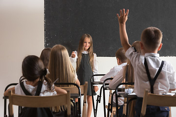 Image showing School children in classroom at lesson