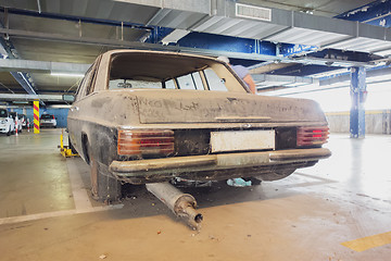 Image showing an old dirty car in a parking garage