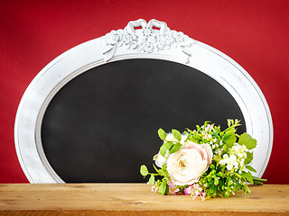 Image showing Spring decoration bunch of flowers and vintage frame