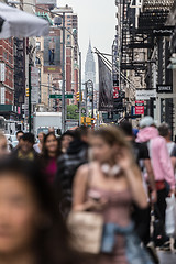 Image showing New York, NY, USA - May 17, 2018: Crowds of people walking sidewalk of Broadway avenue in Soho of Midtown Manhattan on may 17th, 2018 in New York City, USA.