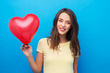 Image showing teenage girl with red heart-shaped balloon