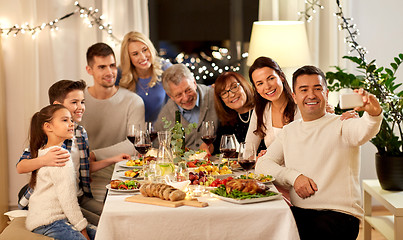 Image showing family having dinner party and taking selfie