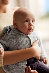 Image showing close up of mother with little baby in cardigan