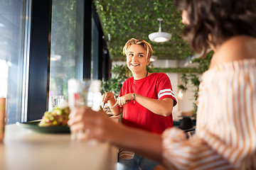 Image showing female friends eating at restaurant