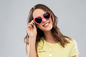 Image showing teenage girl in heart-shaped sunglasses