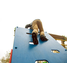 Image showing Boy climbs to the top