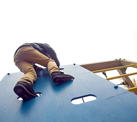 Image showing Boy climbs to the top