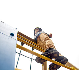 Image showing Boy climbs to the top