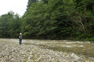 Image showing Boy have fun near the river