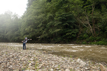 Image showing Boy have fun near the river