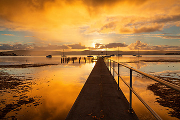 Image showing Sunset skies and water reflections from the jetty