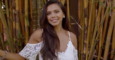 Image showing Beautiful woman standing among bamboo trees