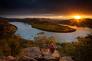 Image showing Watching beautiful sunsets over the mountains brings peace to sou