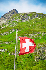 Image showing The Swiss flag is blowing in the wind