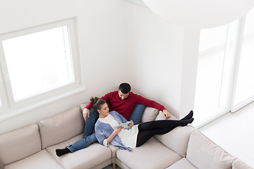 Image showing couple relaxing at  home with tablet computers