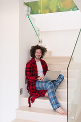 Image showing freelancer in bathrobe working from home