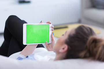 Image showing woman on sofa using tablet computer