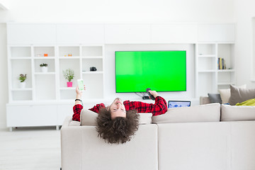 Image showing young man in bathrobe enjoying free time