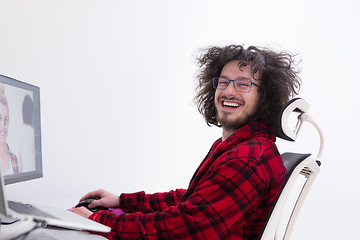 Image showing graphic designer in bathrobe working at home