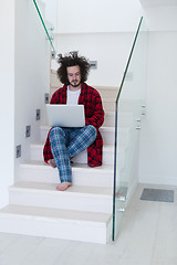 Image showing freelancer in bathrobe working from home