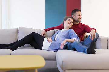 Image showing couple hugging and relaxing on sofa