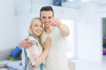 Image showing couple showing a keys of their new house