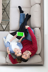 Image showing couple relaxing at  home with tablet computers