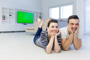 Image showing couple lying on the floor at home