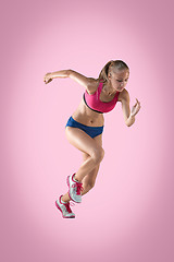 Image showing The studio shot of high jump female athlete is in action