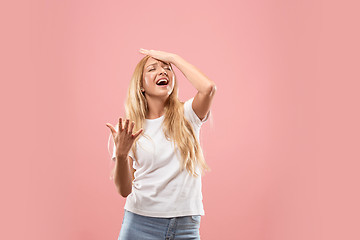 Image showing Beautiful woman looking suprised and bewildered isolated on pink