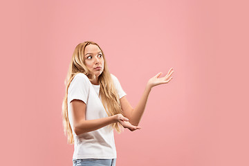 Image showing Beautiful woman looking suprised and bewildered isolated on pink