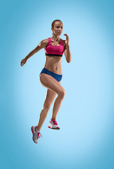Image showing The studio shot of high jump female athlete is in action