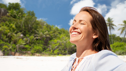 Image showing happy woman over seychelles island tropical beach