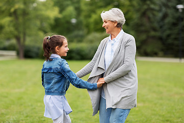 Image showing grandmother and granddaughter playing at park