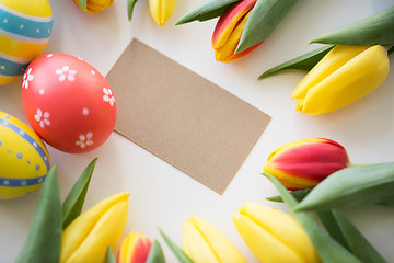 Image showing close up of colored easter eggs and tulip flowers