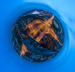 Image showing Mini planet Night Aerial view panorama of a freeway intersection