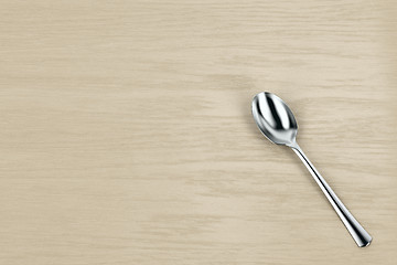 Image showing Silver spoon on table