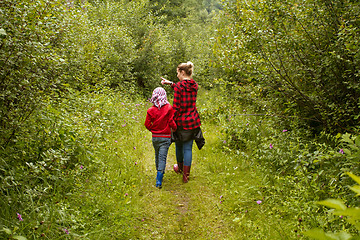 Image showing Mother and son in the forest