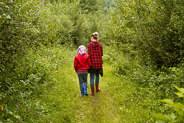 Image showing Mother and son in the forest