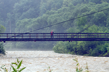 Image showing Mother and son on the bridge