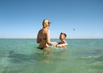 Image showing Mother and son in the sea