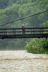 Image showing Mother and son on the bridge