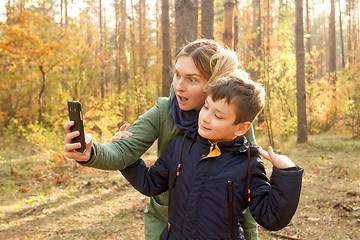 Image showing Son and Mother are making selfie in the Park