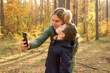 Image showing Son and Mother are making selfie in the Park